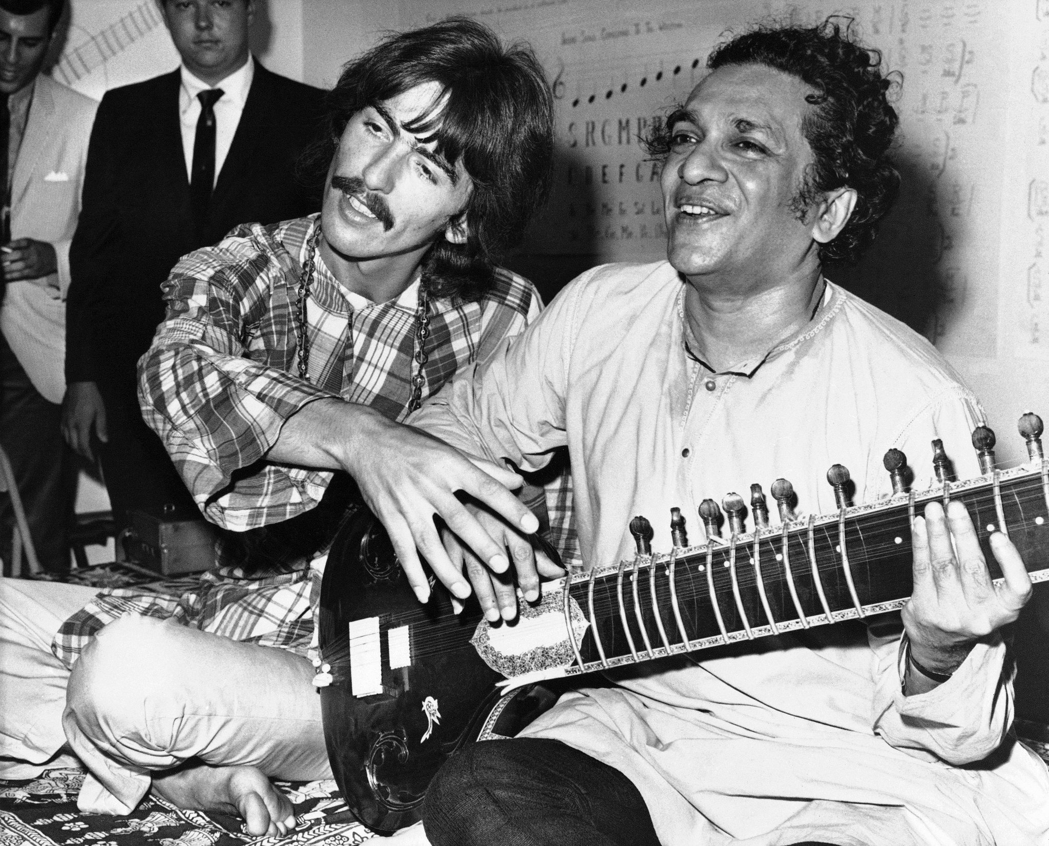 Ravi Shankar with George Harrison – "Ravi Shankar teaching sitar to George Harrison of The Beatles."